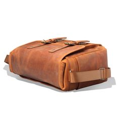 "MegaGear Torres Pro Leather Vintage 16\" Laptop Bag Camera Bag - Briefcase Satchel Portfolio Notebook Tablet Messenger Bag for Men & Women, Business *HIGHEST QUALITY ITALIAN LEATHER BAG - Made from durable, high-quality Italian tan leather, this messenger bag combines handmade aesthetics with the hallmarks of European tannery. Its full-grain leather belts, which secure the front flap to two tuck-clasp buckles, not only add to the beauty but also to the safety of this satchel bag for men / s Large Capacity Satchel Briefcase For Outdoor, Outdoor Satchel Briefcase With Luggage Sleeve, Rectangular Leather Satchel For Outdoor, Rectangular Travel Satchel With Waxed Finish, Outdoor Rectangular Leather Satchel, Rectangular Outdoor Travel Bag With Top Carry Handle, Outdoor Rectangular Travel Bag With Top Carry Handle, Rectangular Waxed Finish Travel Shoulder Bag, Classic Rectangular Laptop Bag For Outdoors