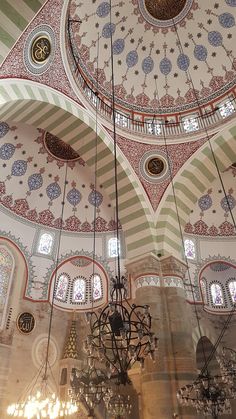 chandelier hanging from ceiling in ornately decorated building