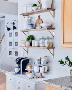 the kitchen is clean and ready to be used as a coffee bar or breakfast bar