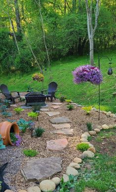 a garden with lots of plants and rocks