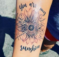 a sunflower tattoo with the words you are my sunshine on it