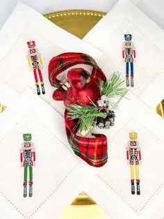 the napkins are decorated with nutcrackers and decorations on top of each other