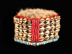 Kuba hat from the Kuba people in the Congo. Made from raffia cloth, cotton, cowrie shells, glass and chicken feathers. Beaded Hats, Conical Hat, Family Wealth, Chicken Feathers, Flat Top Hat, African Artwork, Cowrie Shells