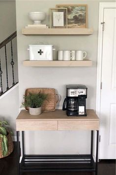 a coffee table with two shelves above it