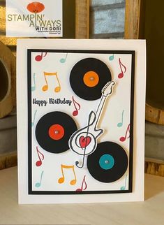 a handmade birthday card with an old record player and musical notes on the front