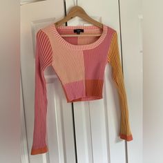 Soft And Stretchy Ribbed Cropped Sweater. Like New, Never Worn. Pink Stretch Patchwork Tops, Pink Long Sleeve Crop Top For Winter, Pink Long Sleeve Top With Contrast Color, Pink Fitted Patchwork Top, Fitted Pink Patchwork Top, Trendy Pink Ribbed Crop Top, Fitted Color Block Pink Top, Fitted Pink Color Block Top, Fitted Multicolor Contrast Top