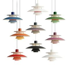 an assortment of different colored lights hanging from a ceiling fixture with one light on each side