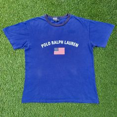 **Vintage Polo Ralph Lauren Tee Shirt**   🐎 **Polo USA Flag Design Crewneck T-Shirt**   👚 **Small Size Retro Graphic Tee** 🌟 **Iconic Brand Polo Ralph Lauren   🎨 **USA Flag Detail Patriotic Vintage Design   👌 **Classic Fit Retro Crewneck Shirt   📏Measurement:📏 Size on Tag: 170 ( Fit S US Men) Width (Pit to Pit): 20.5" Length (Neck to end of garment): 25" Sleeve Length (Neck to end of cuff): 12.5" 👕Condition: Good condition. 7/10. Please refer photos 🚚Shipping: Using Fedex Express shipping. 3-7 days delivery time 🚛Return: Please refer our policy E115-US5 Polo Ralph Lauren T Shirt, Retro Crewneck, Ralph Lauren T Shirt, Retro Graphic Tees, Vintage Polo Ralph Lauren, Fedex Express, Vintage Polo, Crew Neck Shirt, Flag Design