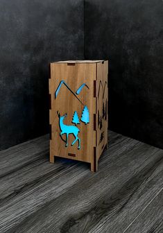 a wooden box with a blue deer on it