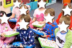 children are sitting in a classroom with star shaped boxes