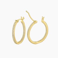 These elegant Gold plated sterling silver inside out micro pave cubic zirconia hoop earrings showcase a striking design that combines style and comfort. The hoop earrings feature a round wire-shaped bar, providing maximum comfort when worn. The inside out design ensures that the shimmering CZ stones are visible from both the front and the inner curve, creating a stunning visual effect. A timeless addition to any jewelry collection, suitable for both casual and formal occasions. 20mm diameter. Cubic Zirconia Hoop Earrings, Micro Pave, Cz Stone, Gold Plated Sterling Silver, Cubic Zirconia, Inside Out, Jewelry Collection, Gold Plate, Hoop Earrings