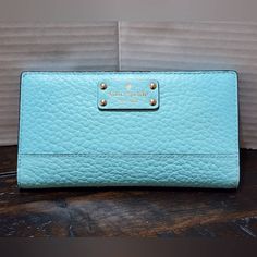 Womens Kate Spade Pebble Leather Wallet Atoll Blue Pebble Leather Manufacturer Color: Atoll Blue 12 Credit Card Slots Zipper Coin Pocket 3 Slots For Money, Receipts, Etc. 7.5��” X 4” New With Tags Smoke Free Pet Free Excellent Like New Condition Please See Pictures For Details Kate Spade Blue Travel Wallet, Kate Spade Leather Wallets For Everyday Use, Kate Spade Blue Rectangular Wallet, Kate Spade Blue Wallet With Card Slots, Snap Wallet, Kate Spade Bag, Pebbled Leather, Leather Wallet, Card Slots