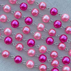 "This fun pink glass pearl chain has a bright look that would be wonderful for all of your vintage designs. This chain features glowing glass pearls in fabulous pinks and fuchsias. As a jewelry designer and wearer, sometimes you need a pink pearl chain that will go with everything! Pair this chain with striking pendants or wear it long and layered for a lovely shabby look. This specialty beaded chain is made with 8mm round glass pearls. The wire links are made of a base metal alloy that has been Pink Pearl Jewelry With 8mm Beads, Pink Pearl Chain Jewelry With Round Beads, Pink Pearl Chain For Jewelry Making, Pink 8mm Beaded Necklace, Pink Necklaces With 8mm Beads, Pink Pearl Necklace, Shabby Look, Jewelry Chain, Rhinestone Cross