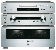 two silver stereos sitting side by side on top of each other