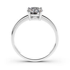 a white gold ring with a single diamond in the center, on a white background