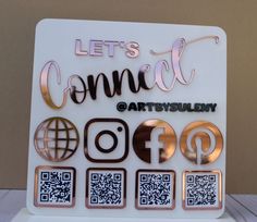 there is a sign that says let's connect artfully and has different symbols on it