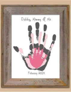 a handprint is displayed in a frame with the words daddy's mommy and me written on it