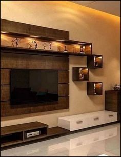 a living room with some shelves on the wall and a television mounted to it's side