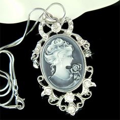 PERFECT GIFT FOR LADIES!!!You are getting a Black Antique Look Cameo and Bow Pendant with Swarovski crystals. It comes with a FREE 18" inches silver-plated rhodium finish snake chain necklace with lobster clasp. Cameo size is 1 3/8" wide X 2 1/2" high (37mm X 62mm).Crystal Color: Crystal Clear===================Prices are in US$.For shipping policies and other important information, click on “profile” on the right.See an item that you like but has already been sold? Contact me to see if I have m Crystal Rhinestone Necklace As Gift, Formal Silver Necklace For Christmas, Silver Formal Necklace For Christmas, Silver Necklace For Christmas Formal Occasion, Antique Cameo Jewelry, Princess Charming, Wedding Studs, Necklace Elegant, Cameo Jewelry