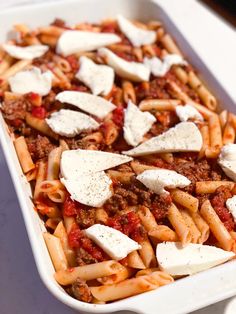 a casserole dish filled with pasta and cheese