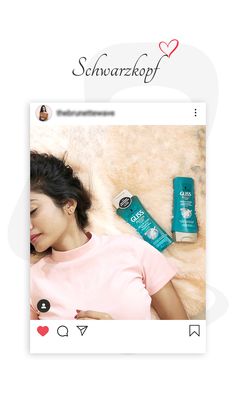 a woman laying on top of a bed next to a bottle of shampoo