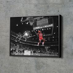 an autographed basketball player jumping in the air