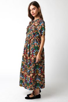 The Emery Maxi Dress brings a touch of fall with its sweeping black maxi silhouette and bold multicolor floral print. With a tie-up front and flowy short sleeves, it's the perfect blend of easy elegance and charm. This dress is made for those days when you want to feel effortlessly stunning. Color: Black Multi 100% Cotton Cold hand wash, hang to dry. Item #2406-114LDZ Please call for in-store availability Size/Fit Model is wearing size S. Black Short Sleeve Maxi Dress With Floral Print, Black Floral Print Short Sleeve Maxi Dress, Multicolor Floral Print Maxi Dress With Short Sleeves, Multicolor Print Maxi Dress With Short Sleeves, Flowy Shorts, Instagram Blog, Those Days, Black Maxi, New Shop