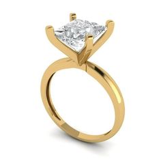 a gold engagement ring with a princess cut diamond in the center, on a white background