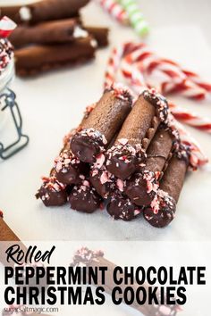 peppermint chocolate christmas cookies are stacked on top of each other and surrounded by candy canes