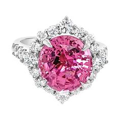 A 5.08 carat oval cut natural pink spinel surrounded by a halo of 1.03ct total weight in round brilliant cut diamonds set in 18 karat white gold. This ring is currently a size 6 but can be resized upon request. Measurements: 10.78 x 10.15 x 6.67 mm GIA Report: 6207318353 Pink Spinel, Jewelry Accessories Ideas, Round Brilliant Cut Diamond, Brilliant Cut Diamond, White Gold Rings, Cocktail Rings, Halo Diamond, Oval Cut, Round Brilliant