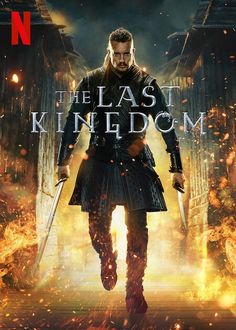 the last kingdom movie poster with a man in armor holding two swords and standing on fire