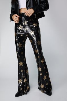 The pants edit. Feel like the centre of attention in our flare pants, made in high quality sequin fabric, with a flattering flared silhouette and a statement star pattern. Style the with a crop top or bralette for a stellar occasion look, perfect for anything from party nights to festival weekends and concerts. Star Sequin Flare Pants High Quality Sequin Fabric Flattering Flared Silhouette Stellar High Waistline Fun Star Patterning Zip Fastening in Back Model wears a size S (US size 6/UK size 10). Sequin Flare Pants, Going Out Trousers, Oasis Fashion, Flare Trousers, Sequin Fabric, Star Pattern, Elegant Outfit, Fashion Face, Eras Tour