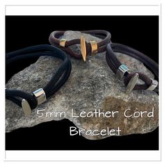 5mm Natural Leather Cord Bracelet can can be worn by Men or Women!  Rugged/Boho style with a stainless steel toggle clasp. All leather cord is natural NOT DYED. Choose color and clasp under the OPTION TAB.  All Bracelets come with a gift box. MEASUREMENTS CORD:  5mm ROUND (double strand 10mm total) CLASP: 10mm x 5mm STAINLESS STEEL Mens Bracelet Gold Jewelry, Leather Cord Bracelets, Mens Gold Bracelets, Can Can, Cord Bracelet, Cord Bracelets, Bracelet Gold, Toggle Clasp, Leather Cord