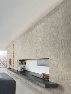 a living room filled with furniture next to a wall mounted shelf on the side of a wall