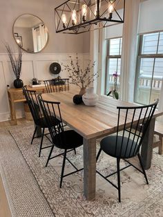 a dining room table with four chairs around it