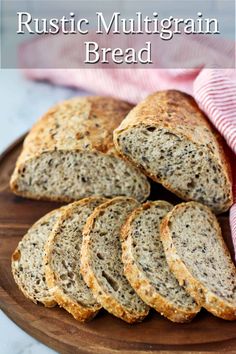 sliced bread on a wooden plate with text overlay that reads rustic mulligrain bread