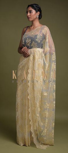 Buy Online from the link below. We ship worldwide (Free Shipping over US$100)  Click Anywhere to Tag Parchment White Saree In Net With Weaved Golden Floral Motifs And Kundan Work Online - Kalki Fashion Parchment white saree in net with weaved golden floral motifs.Further enhanced with kundan work all over. Sonakshi Sinha Saree, Kundan Work, Work Online