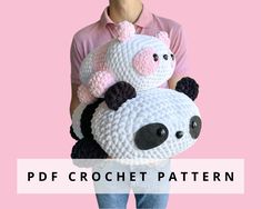 a person holding a crochet panda bear in front of a pink background with the text, free pattern