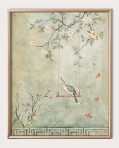 a bird sitting on a swing in front of a tree with pink flowers and leaves