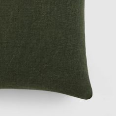 a green pillow on a white background