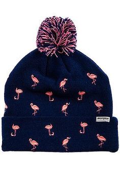 a blue beanie with pink flamingos on it and a pom - pom