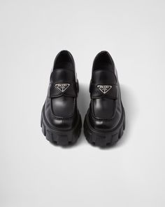 Black Brushed Leather Monolith Loafers | PRADA Black Calf Leather Platform Loafers With Lug Sole, Leather Platform Loafers With Lug Sole, Formal Leather Loafers With Lug Sole, Formal Leather Platform Loafers With Lug Sole, Formal Leather Platform Loafers With Textured Sole, Classic Calf Leather Platform Loafers With Lug Sole, Leather Platform Loafers With Studded Rubber Outsoles, Luxury Business Platform Loafers With Rubber Sole, Calf Leather Loafers With Vibram Sole