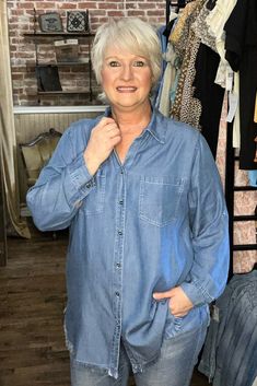 This oversized denim shirt features a full-button closure and a fringed hem. It also includes front pockets for added convenience. Pair it with leggings or your go-to jeans for a chic and comfortable look. Oversized Denim Shirt, Denim Shirt, Leggings, Women's Top