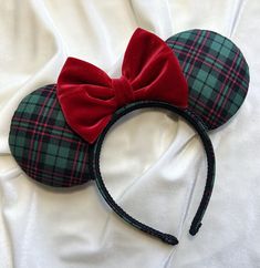 Get into the Christmas spirit with this cute Green Plaid & Red Velvet Bow Mouse Ears. All ears are handmade and made to order. Each pair is high quality, as I spend a great deal of time on each individual pair. Print placement, colors and accessories may vary slightly from the item pictured, however, every effort will be made to duplicate the item as pictured. The headband used for all ears fits most children and adults (this headband is very comfortable and does not pinch behind the ears). Cust Disney Ears Christmas, Christmas Minnie Ears, Christmas Disney Ears, Christmas Mickey Ears, Universal Christmas, Christmas Florida, Micky Ears, Mouse Ears Disney, Disney Apparel