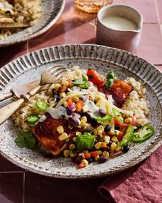 two plates filled with food on top of a table