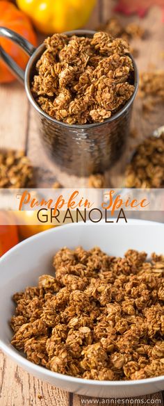 granola in a white bowl on top of a wooden table next to oranges