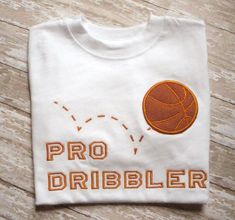 a t - shirt that says pro dribbler on it with a basketball in the middle