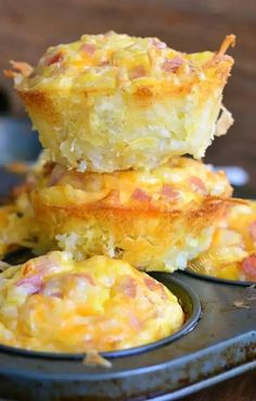 three breakfast muffins stacked on top of each other in a muffin tin