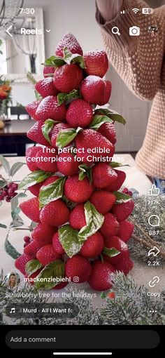 a christmas tree made out of strawberries and leaves