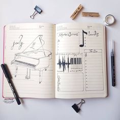 an open notebook with musical notes and keys